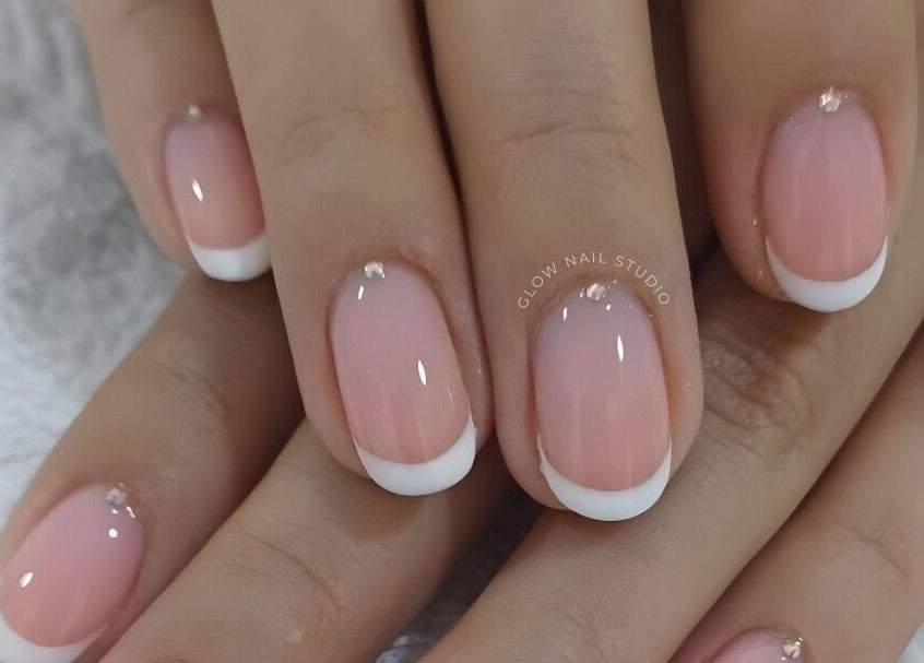 Close-up of elegant French manicure at Glow Nail Studio, Cape Town, Western Cape, ZA.