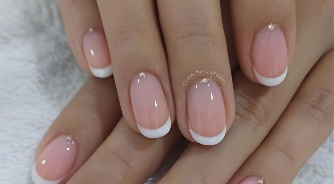 Close-up of elegant French manicure at Glow Nail Studio, Cape Town, Western Cape, ZA.