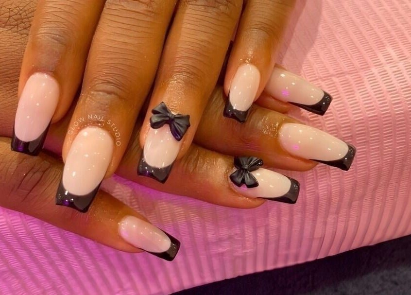 Elegant black bow nail design at Glow Nail Studio, Cape Town, Western Cape, ZA.