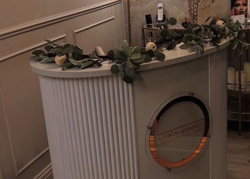 Chic reception area at Sculpted by Jo, Stourbridge, England, GB, adorned with greenery and candles.