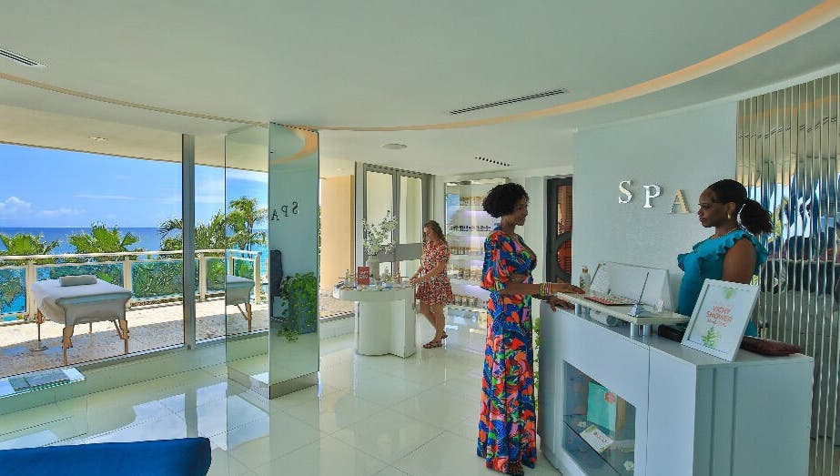 Reception area at NECTAR Spa CLIFF with an ocean view in Cupecoy, SX featuring friendly staff.