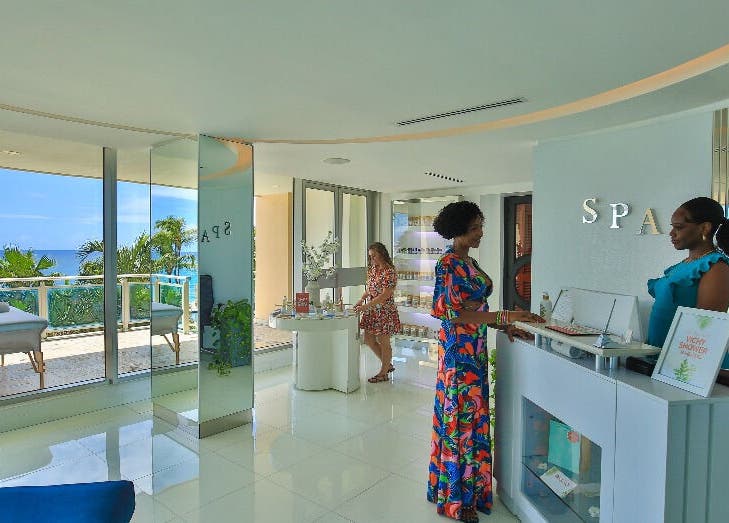 Reception area at NECTAR Spa CLIFF with an ocean view in Cupecoy, SX featuring friendly staff.