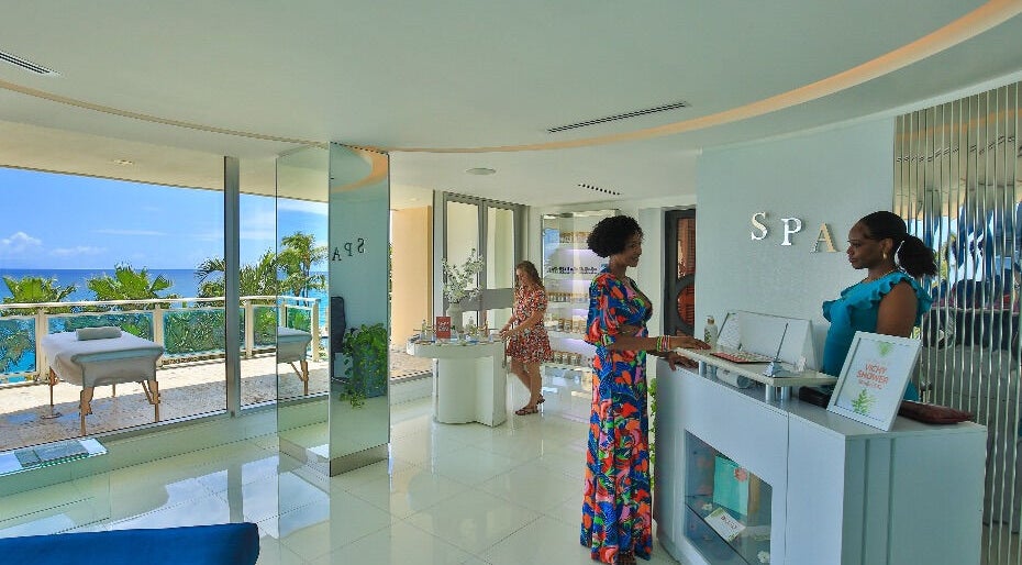 Reception area at NECTAR Spa CLIFF with an ocean view in Cupecoy, SX featuring friendly staff.