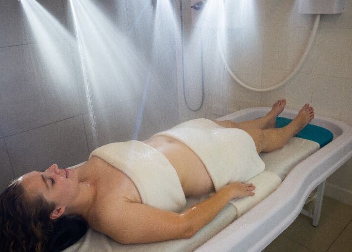 Relaxing hydrotherapy session at NECTAR Spa CLIFF, Cupecoy, SX, showcasing soothing water jets.