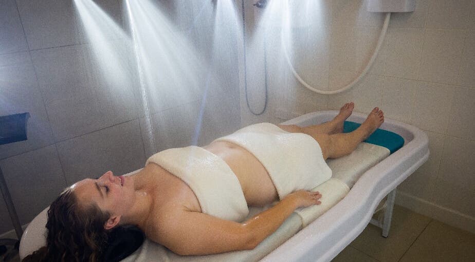 Relaxing hydrotherapy session at NECTAR Spa CLIFF, Cupecoy, SX, showcasing soothing water jets.