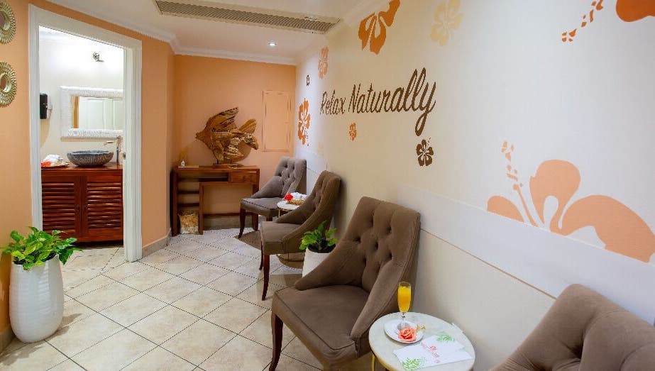 Relaxing seating area at NECTAR Spa OBBR, Oyster Bay, SX with calming decor and seating.