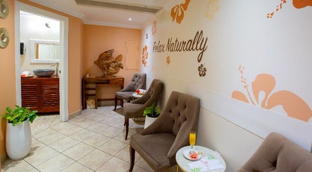 Relaxing seating area at NECTAR Spa OBBR, Oyster Bay, SX with calming decor and seating.