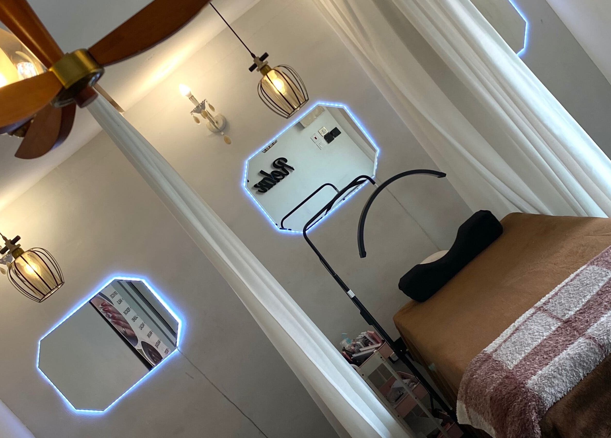 Cozy treatment room at Everything Nails & Spa, Accra, Greater Accra Region, GH with ambient lighting.