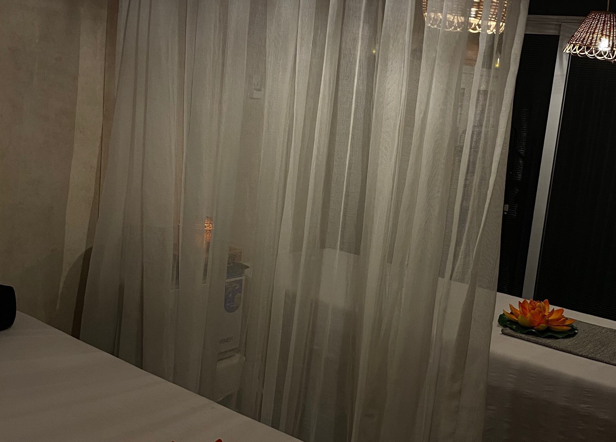 Tranquil massage room at Everything Nails & Spa, Accra, Greater Accra Region, GH with sheer curtains.
