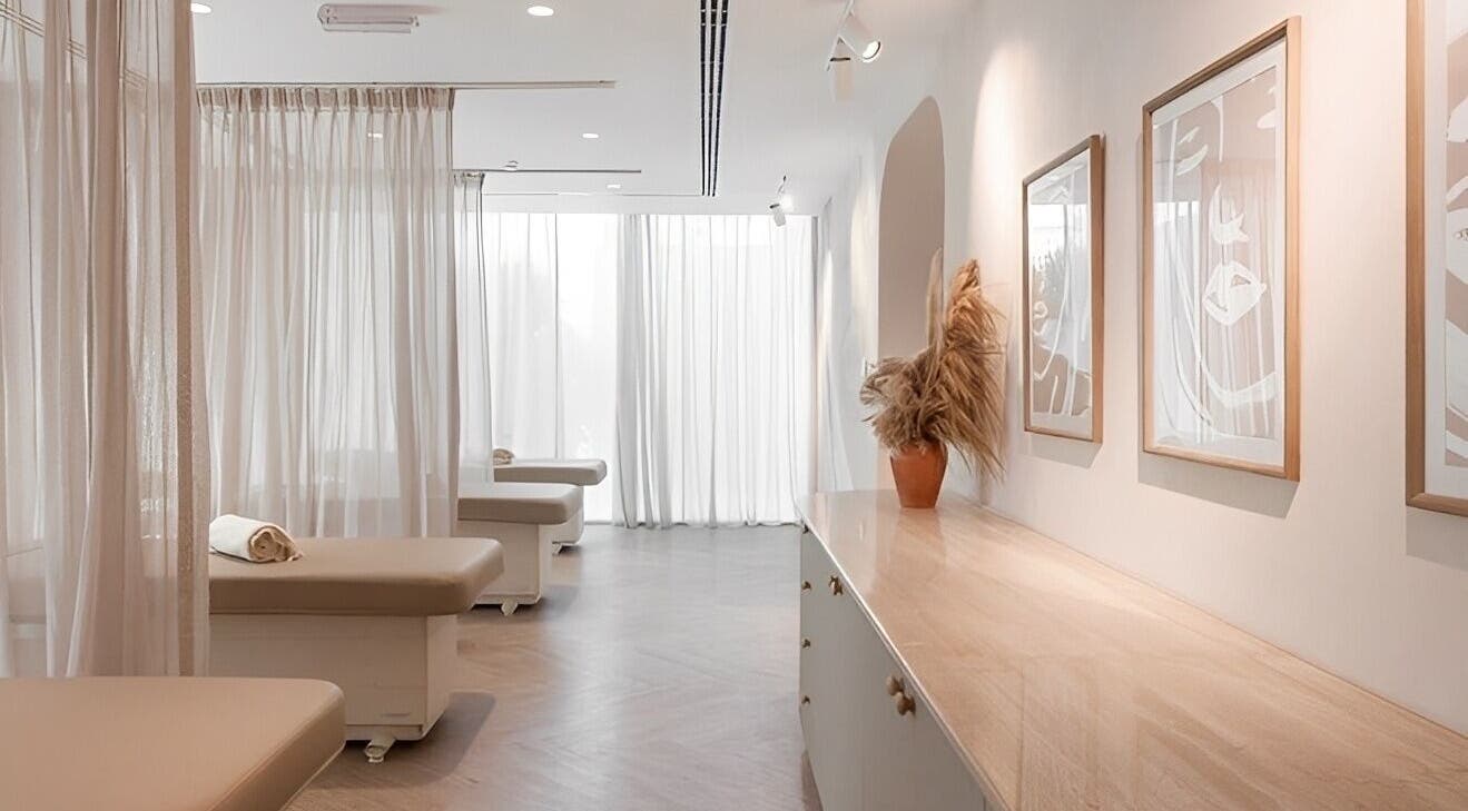 Tranquil spa room at BaharBrows, Dubai, Dubai, AE with soft curtains and calming decor.