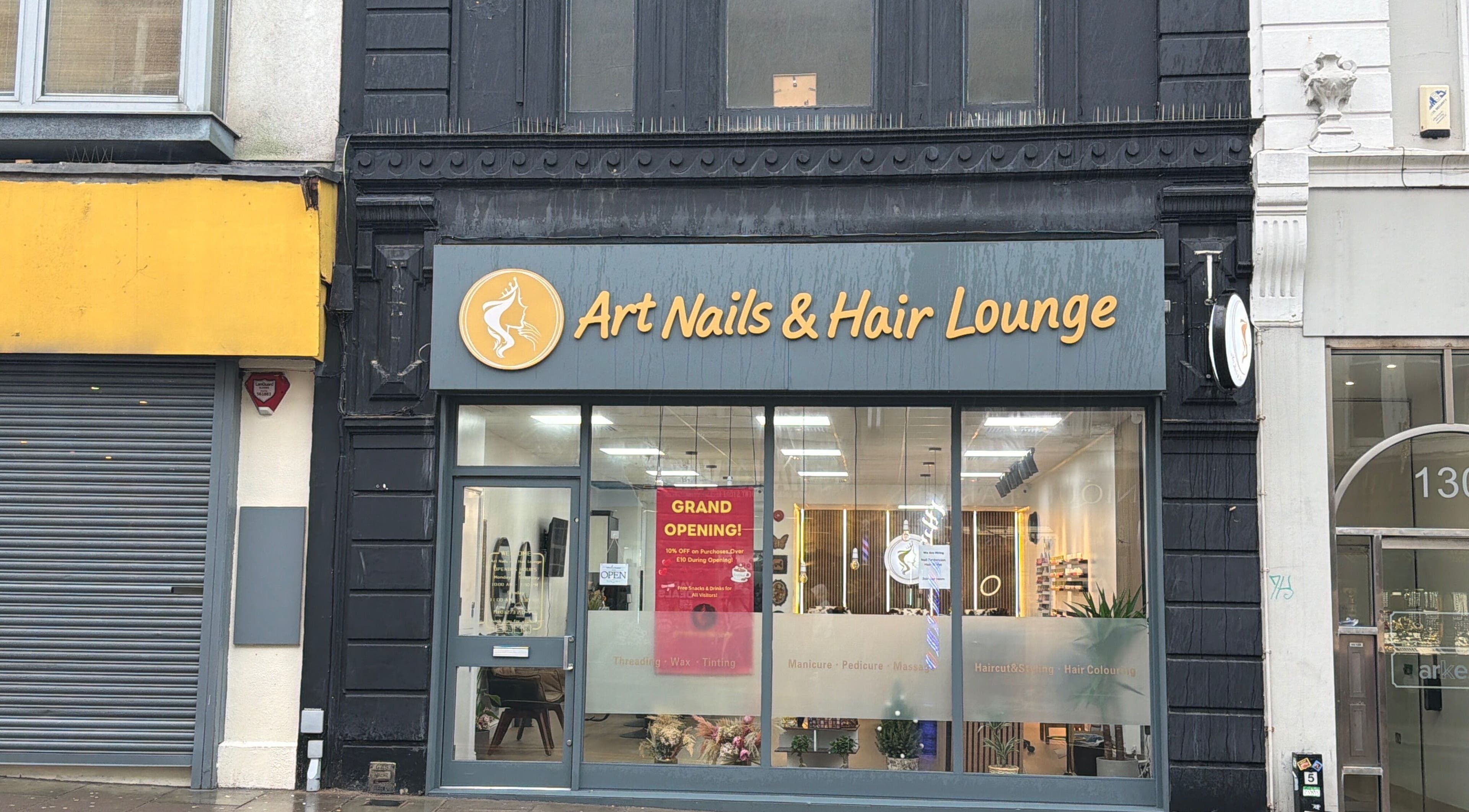 Exterior of Art Nails&Hair Lounge in Brighton And Hove, England, featuring grand opening signage.