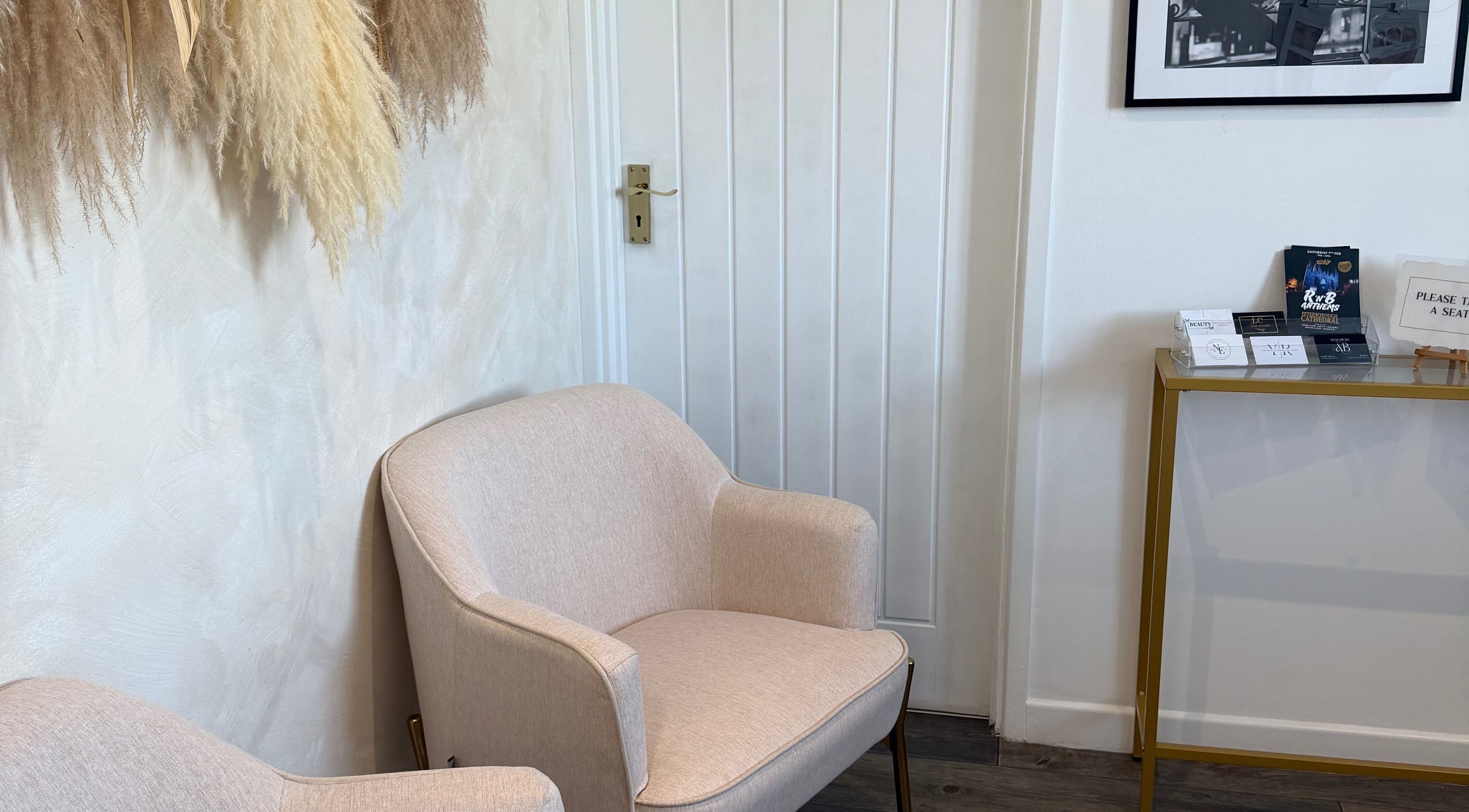 Inviting seating area at Reve Wellness Clinic, Peterborough, England, GB. Elegant chairs and decor create a warm ambiance.
