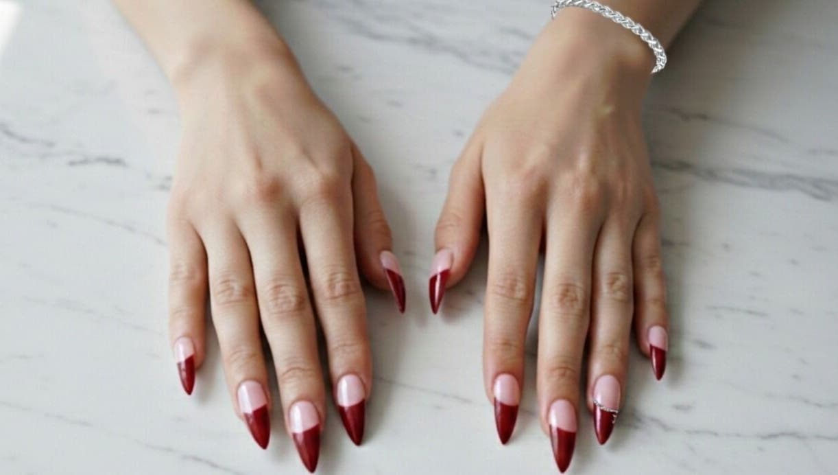 Stunning red-tipped nails at The Cherry Crimson Studio, Germiston, Gauteng, ZA, displaying elegance.