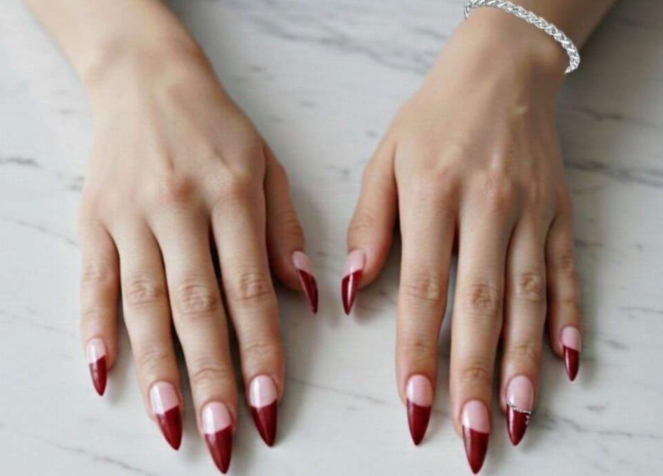 Stunning red-tipped nails at The Cherry Crimson Studio, Germiston, Gauteng, ZA, displaying elegance.