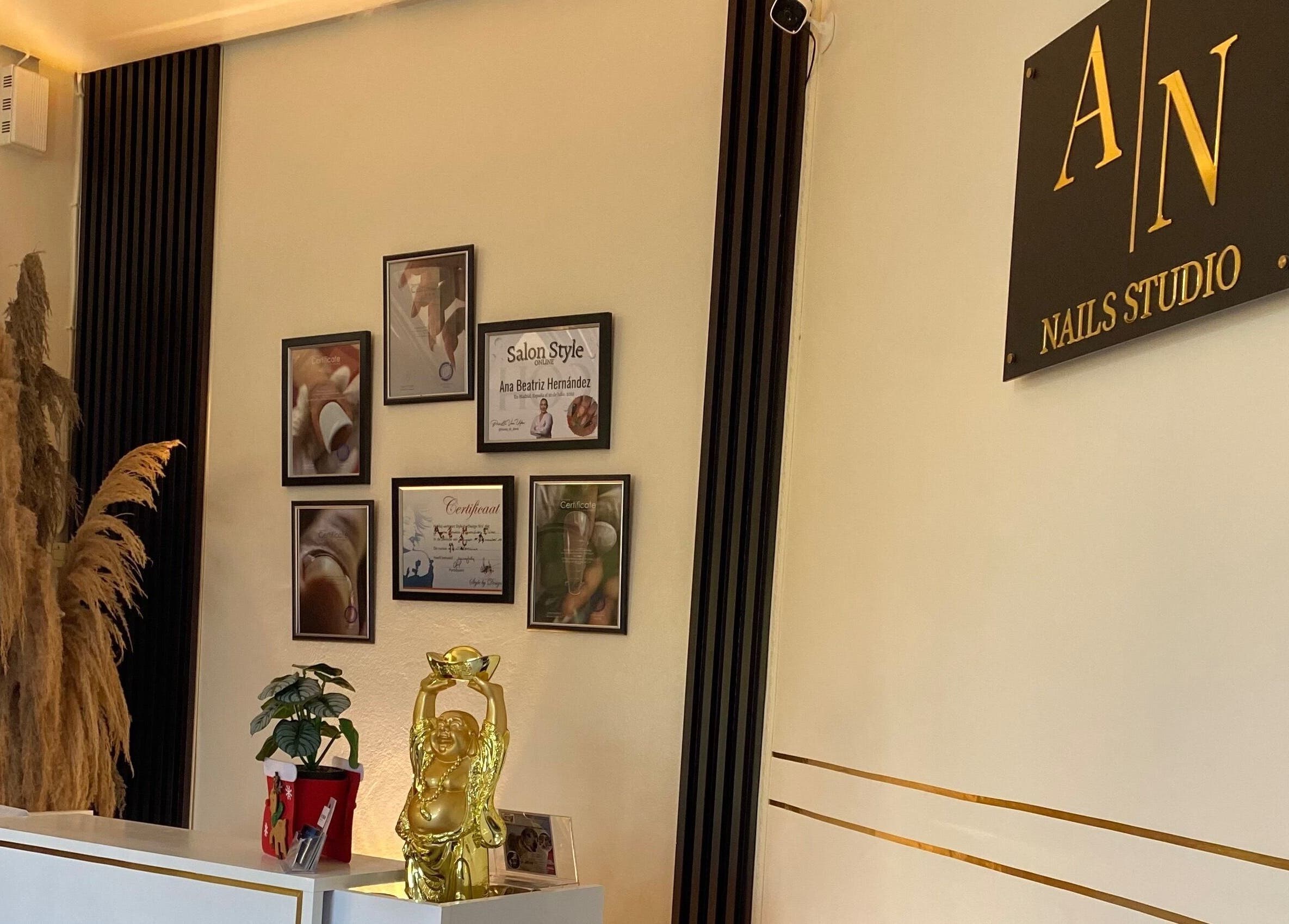 Reception decor at Ana's Nails Studio in Paramaribo, Paramaribo, SR with stylish frames and plants.