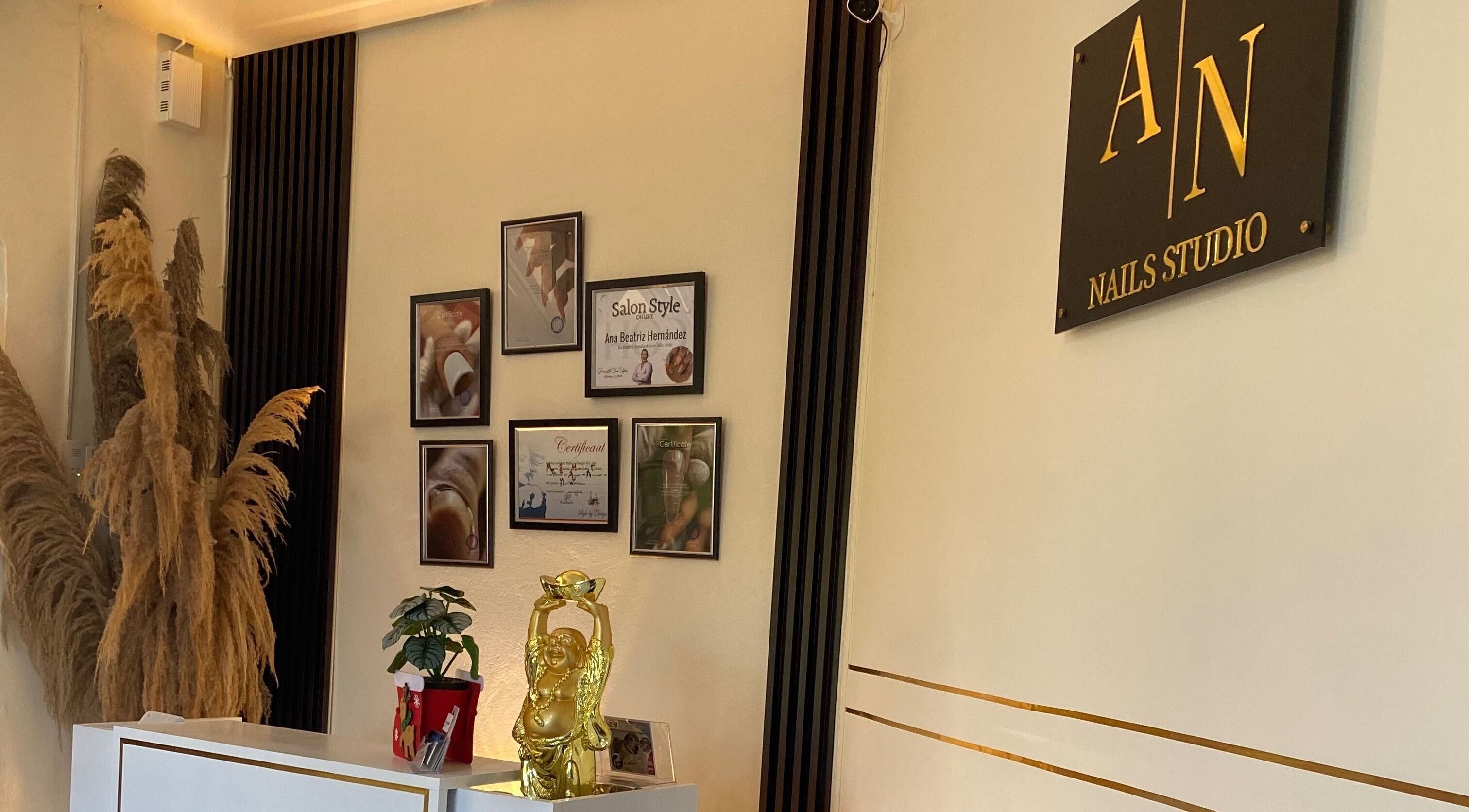 Reception decor at Ana's Nails Studio in Paramaribo, Paramaribo, SR with stylish frames and plants.