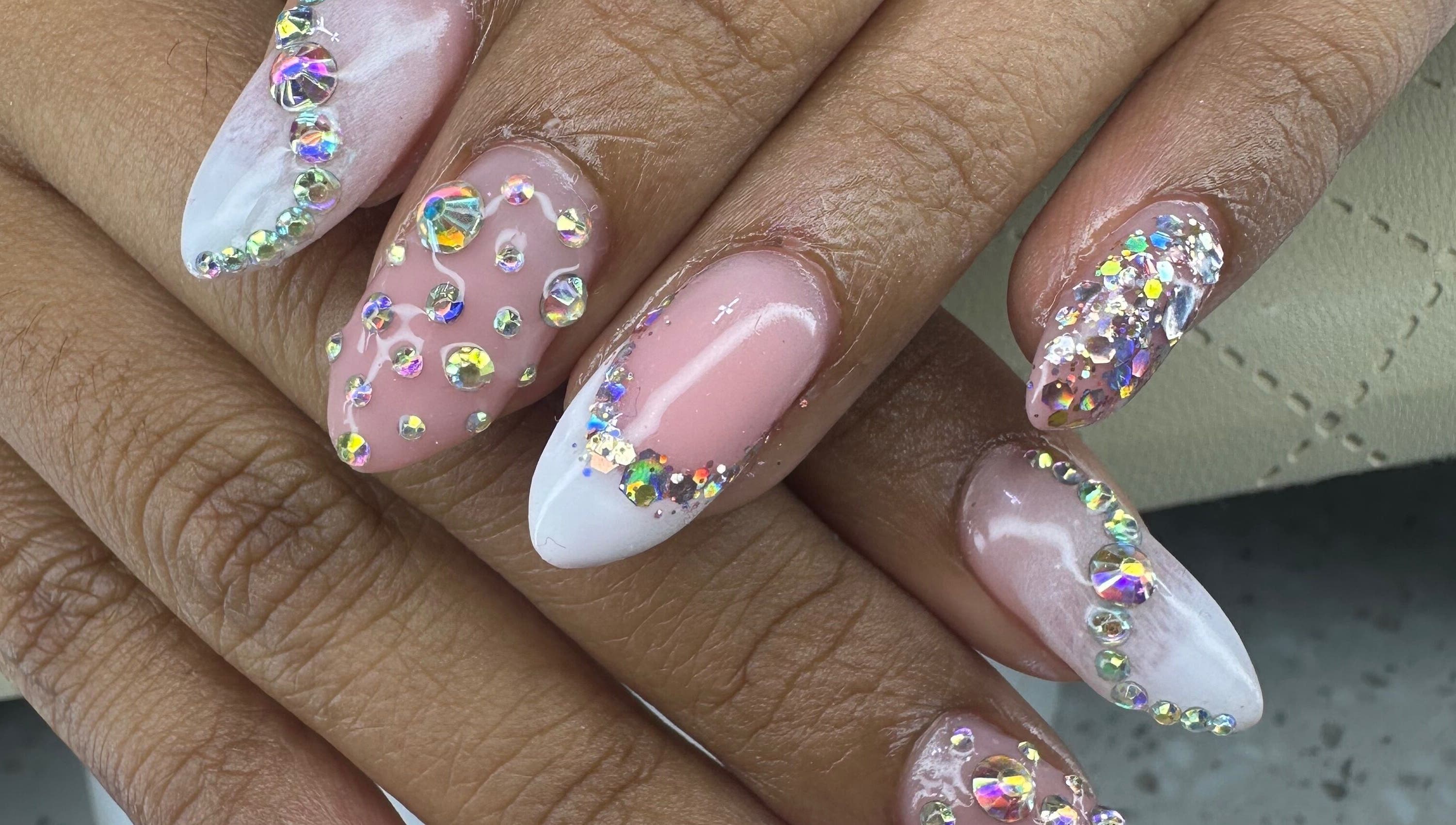 Stunning gemstone nail art at Aleya's Infinite Glow, Paramaribo, Paramaribo, SR. Embellished with sparkling crystals.