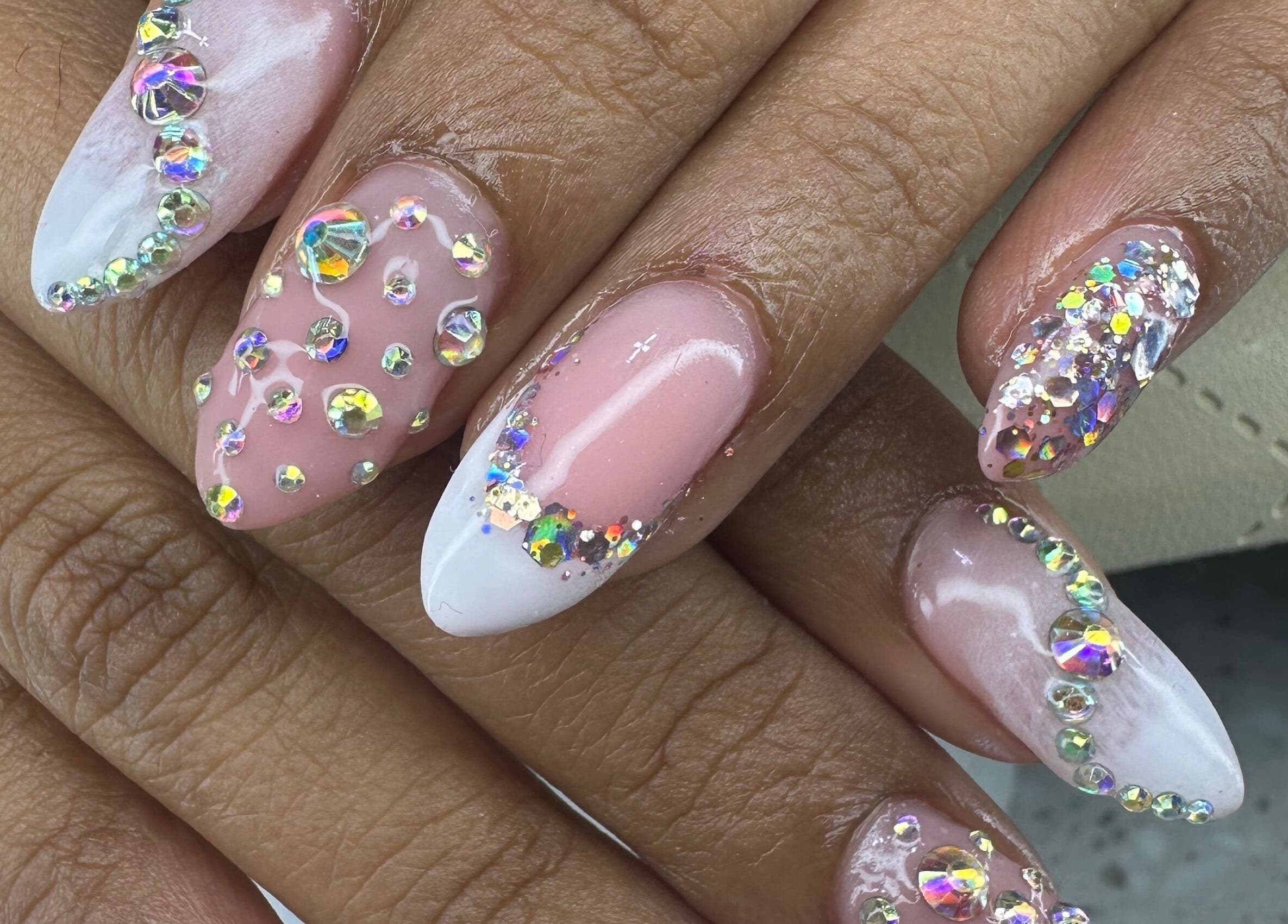 Stunning gemstone nail art at Aleya's Infinite Glow, Paramaribo, Paramaribo, SR. Embellished with sparkling crystals.