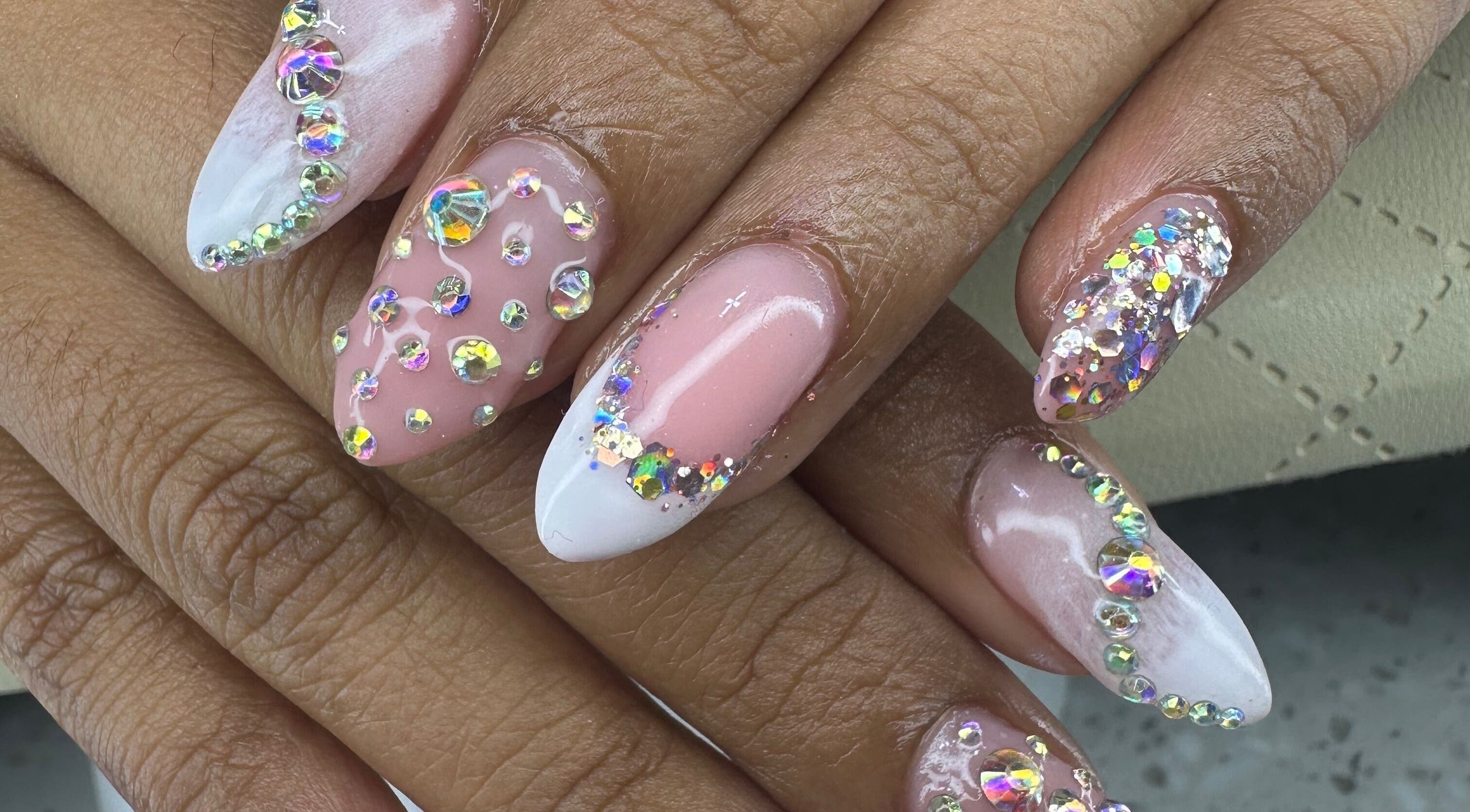 Stunning gemstone nail art at Aleya's Infinite Glow, Paramaribo, Paramaribo, SR. Embellished with sparkling crystals.