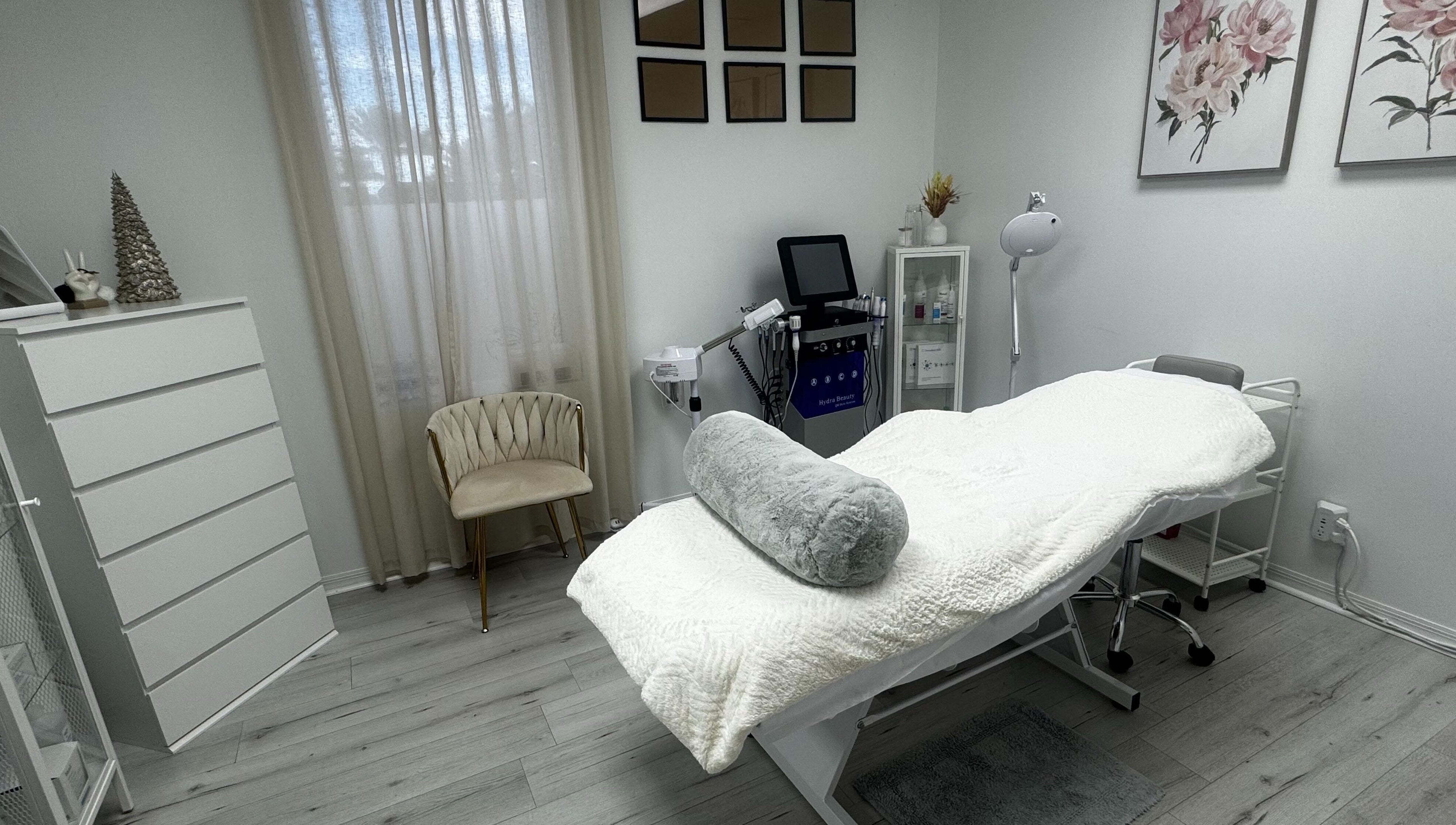 Relaxing treatment room at Tanova Aesthetics, Hallandale Beach, Florida, US. Featuring cozy bed and elegant decor.