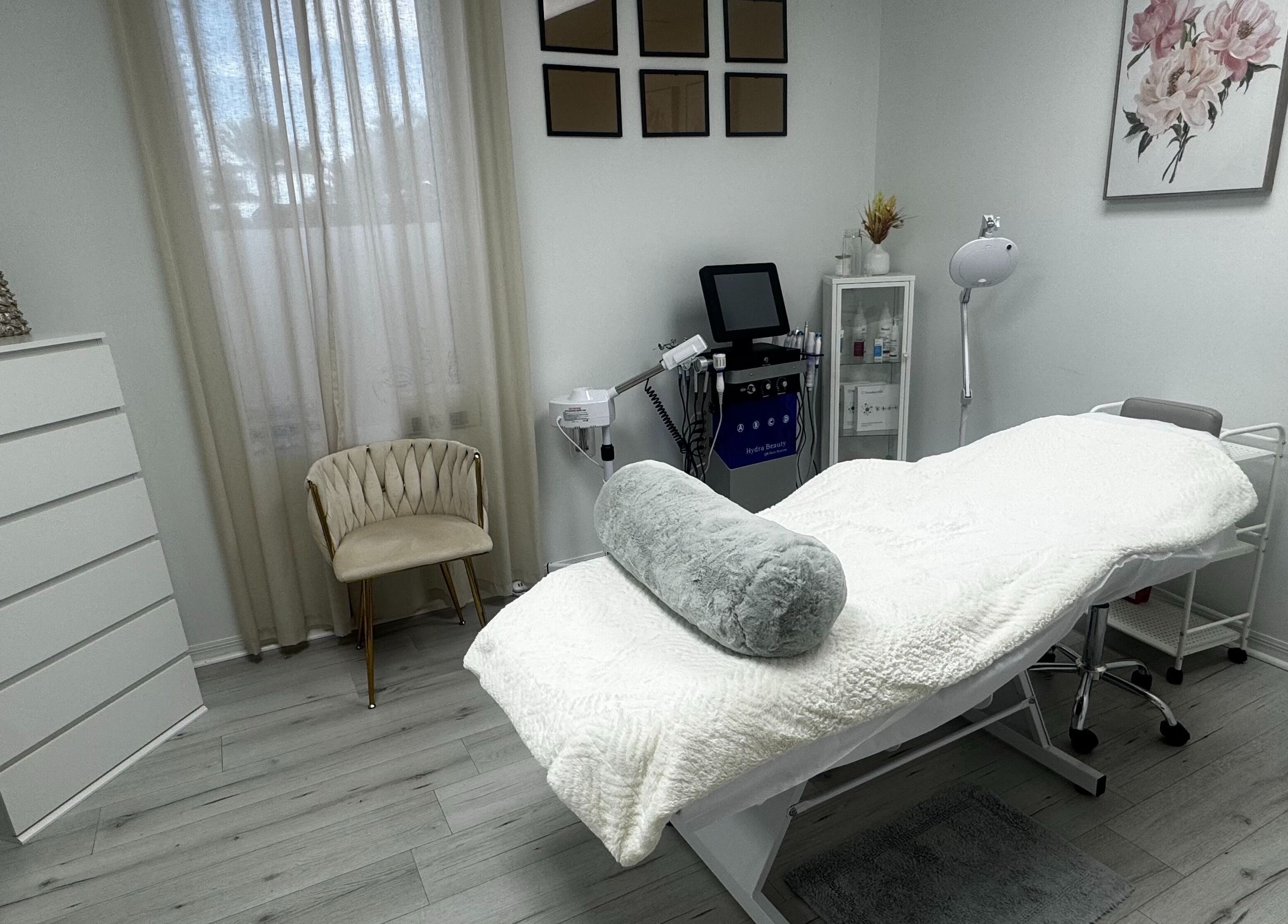 Tranquil treatment room at Tanova Aesthetics, Hallandale Beach, Florida, US, featuring a cozy bed and decor.