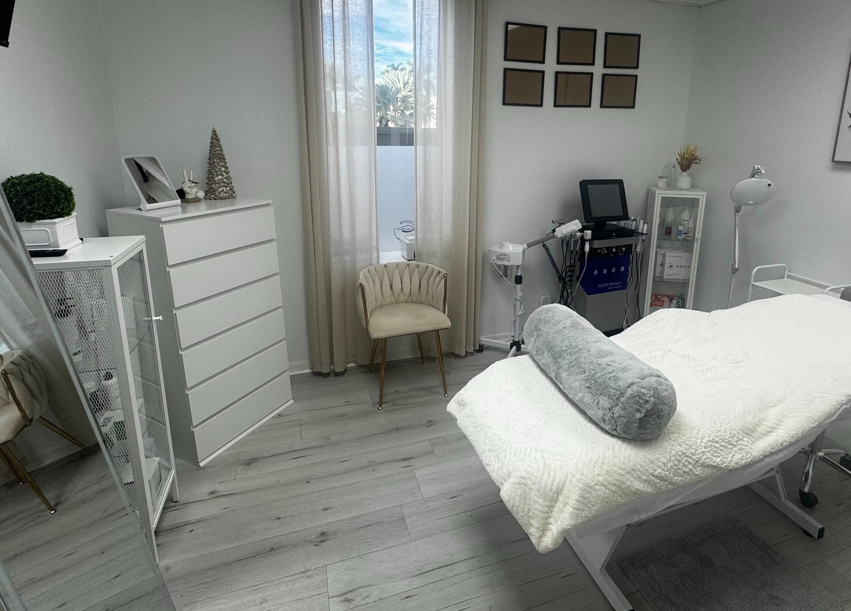 Elegant treatment room at Tanova Aesthetics in Hallandale Beach, Florida, US, with a modern minimalist design.