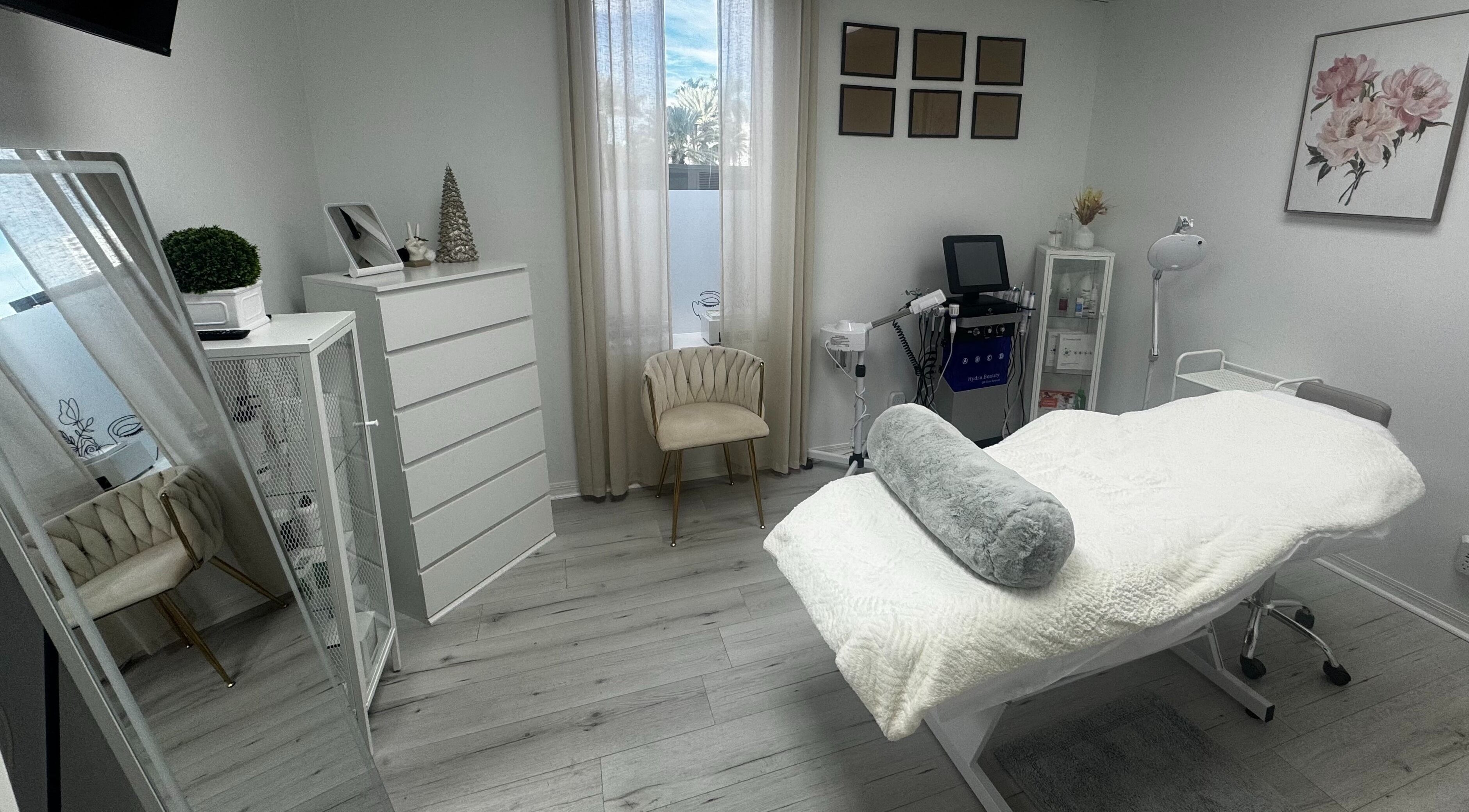 Elegant treatment room at Tanova Aesthetics in Hallandale Beach, Florida, US, with a modern minimalist design.
