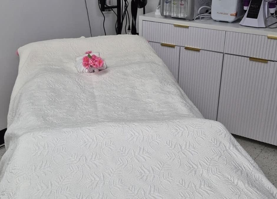 Tranquil treatment room at Dubai Lux Spa, Barnstable, Massachusetts, US, with a plush bed and elegant decor.