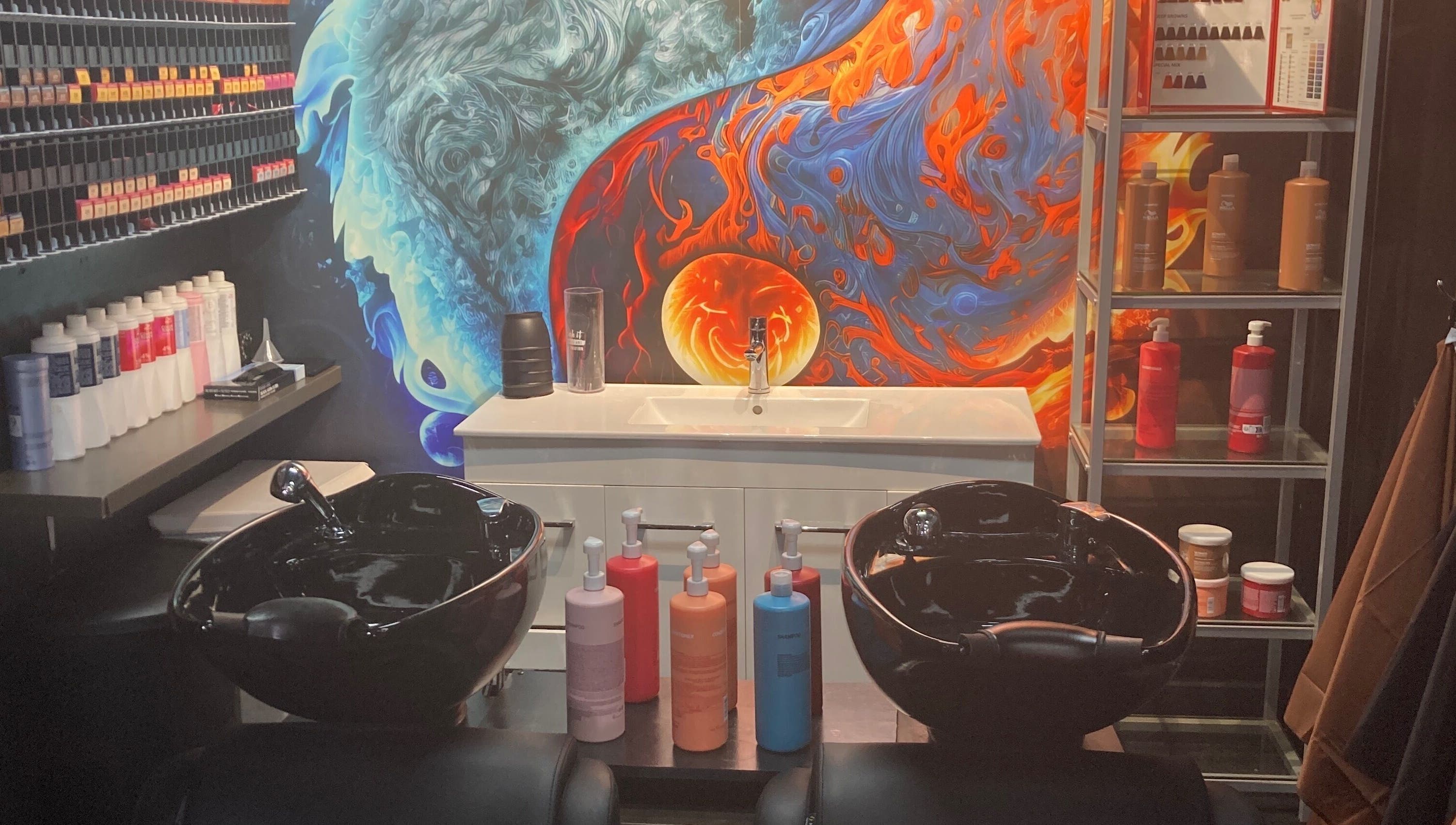 Colorful salon hair wash station at MGP Salon, Nickol, Western Australia, AU with artful wall design.