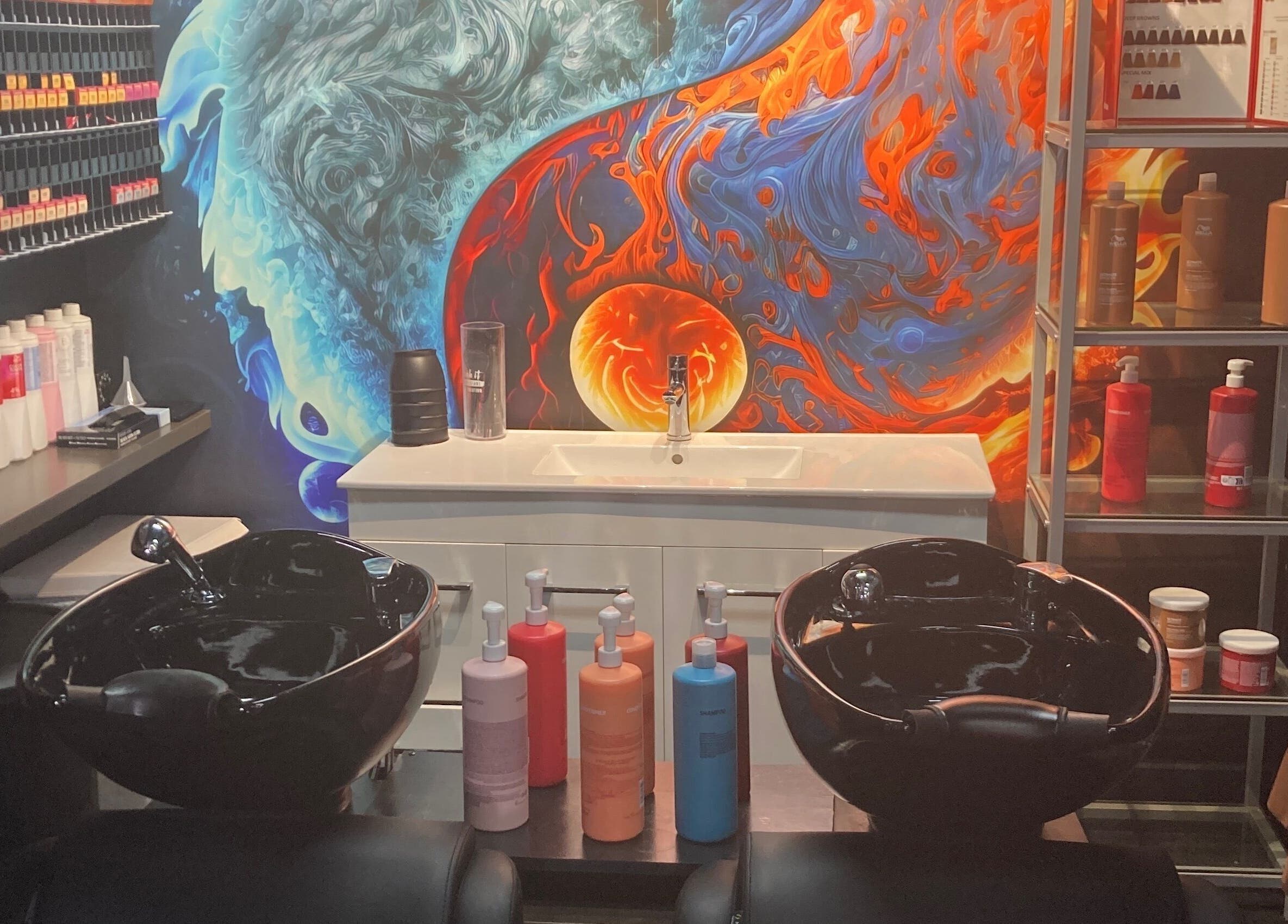 Colorful salon hair wash station at MGP Salon, Nickol, Western Australia, AU with artful wall design.