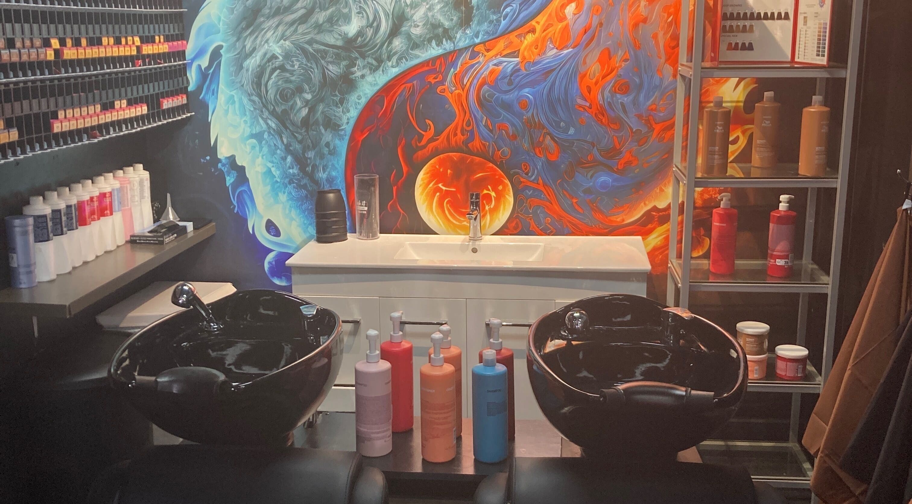 Colorful salon hair wash station at MGP Salon, Nickol, Western Australia, AU with artful wall design.