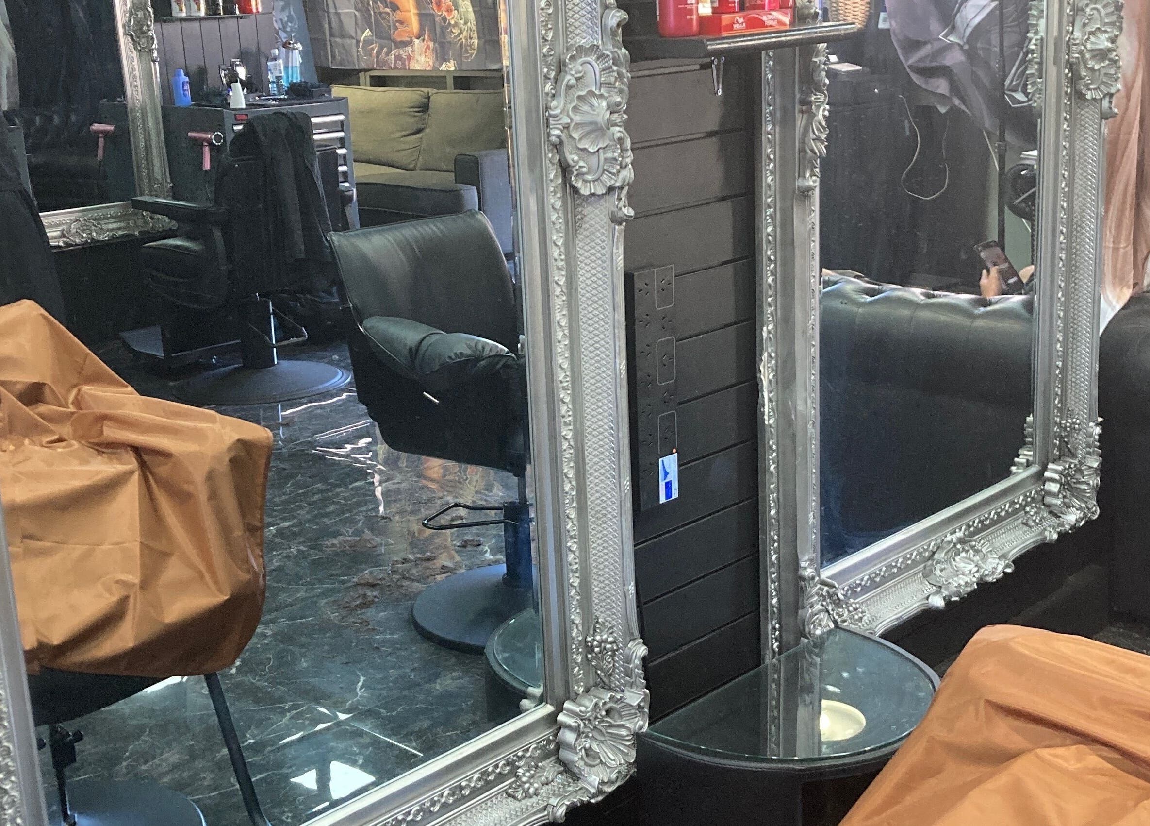 Chic interior of MGP Salon in Nickol, Western Australia featuring ornate mirrors and modern chairs.