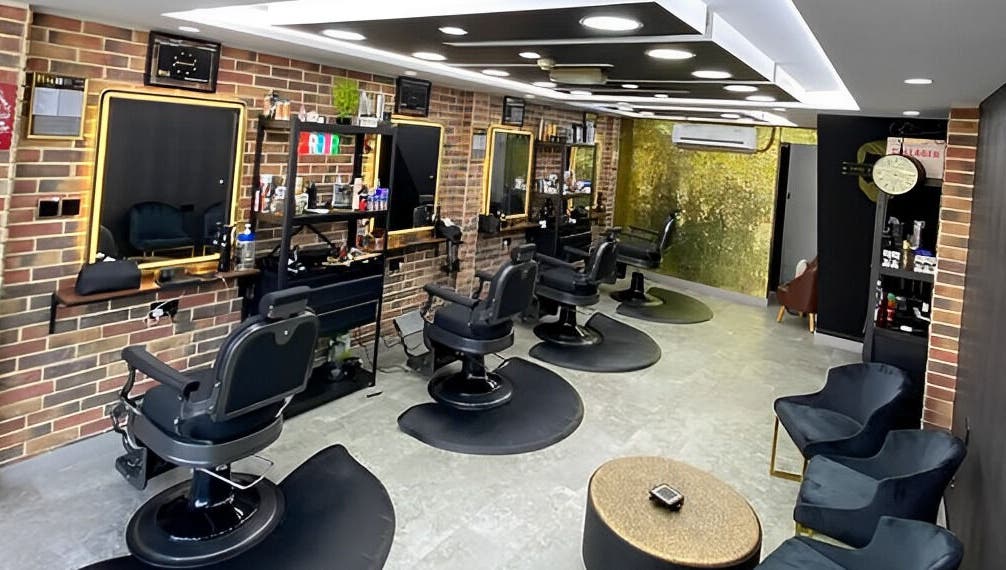 Modern interior of Best Cuts Gents Salon in Dubai, Dubai, AE showcasing sleek barber chairs and stylish decor.