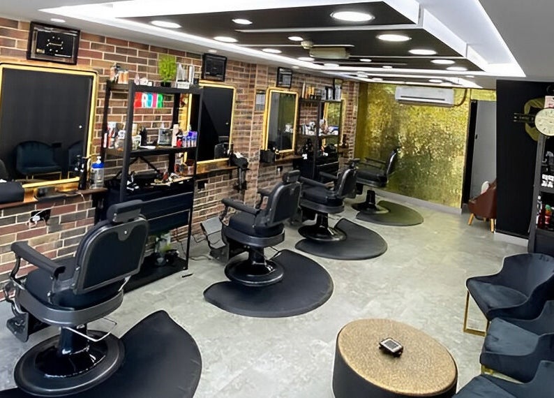 Modern interior of Best Cuts Gents Salon in Dubai, Dubai, AE showcasing sleek barber chairs and stylish decor.