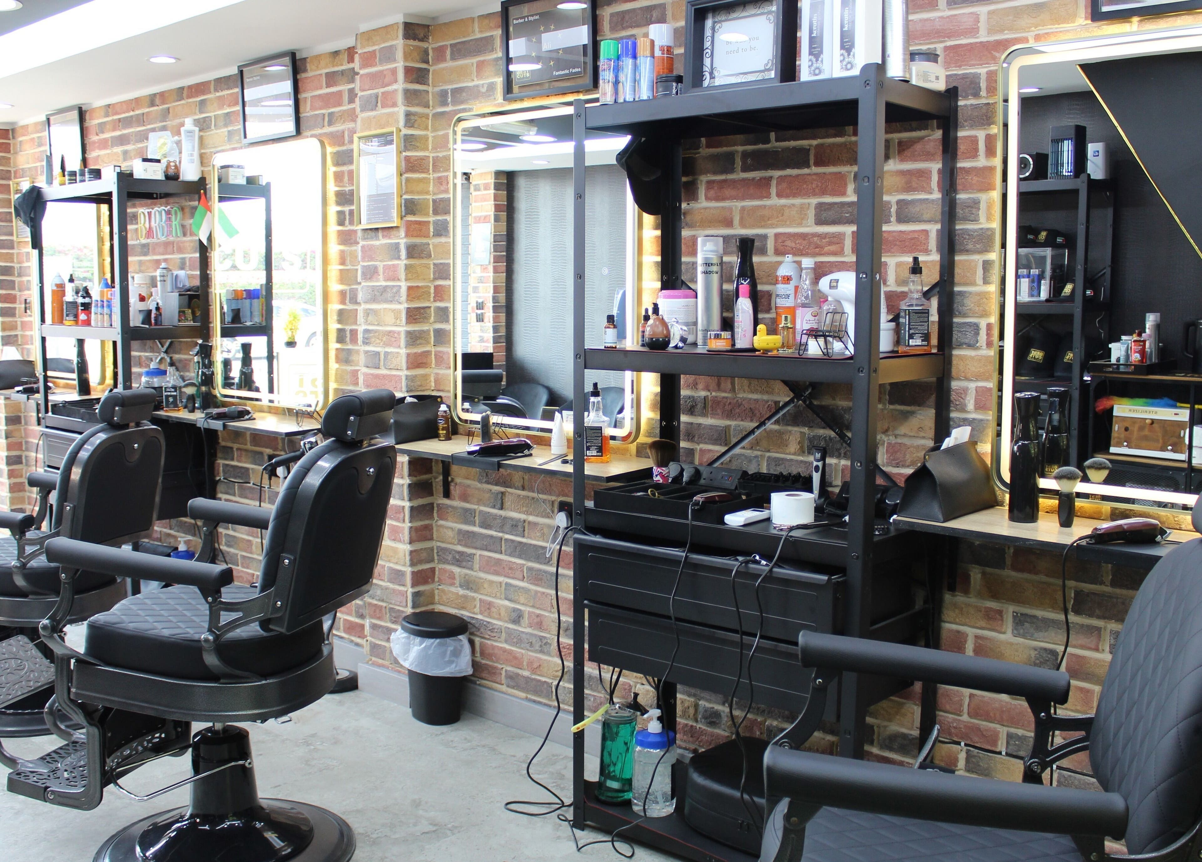 Stylish interior of Best Cuts Gents Salon in Dubai, Dubai, AE with barber chairs and grooming products.