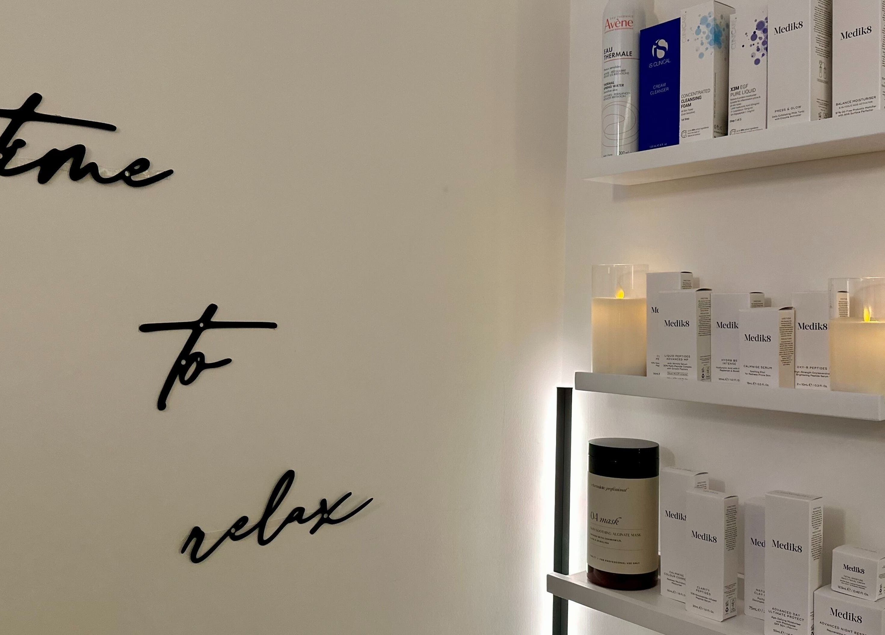 The Skincare Snug in Yate, England, GB: serene shelves with candles and skincare products.