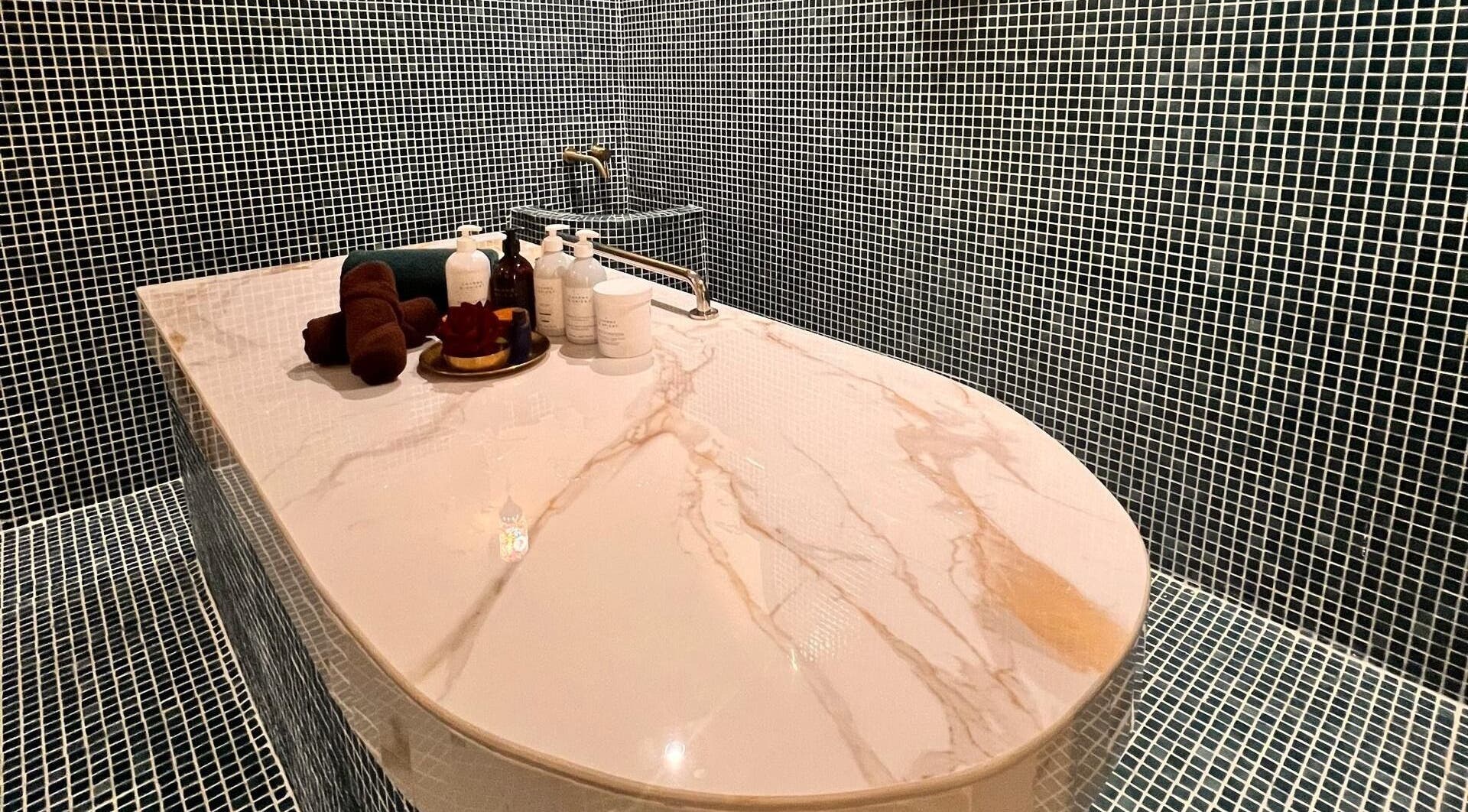 Luxurious marble spa table at Spa Jelita Malaysia, Kuala Lumpur for rejuvenating treatments.