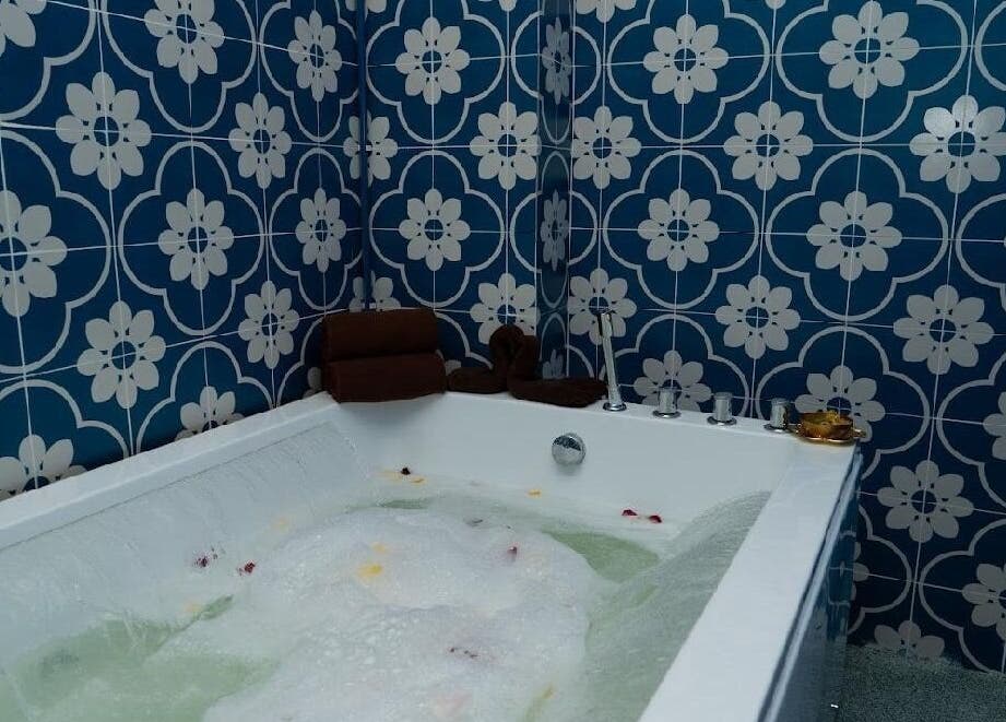 Luxurious spa bath at Spa Jelita Malaysia, Kuala Lumpur, Wilayah Persekutuan Kuala Lumpur, MY with floral tiles.
