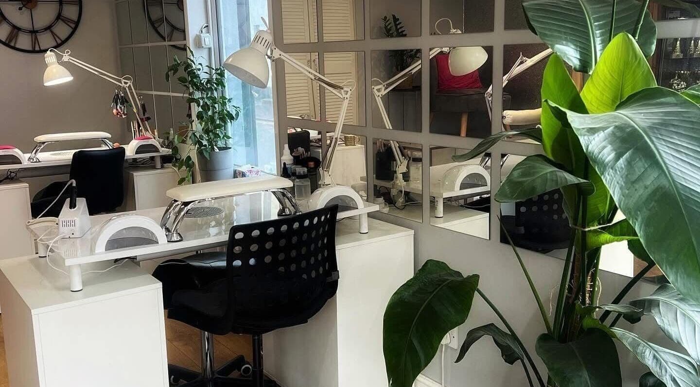Stylish nail studio interior at ARCHNAILGEL, Swindon, England, GB with sleek furniture and vibrant plants.