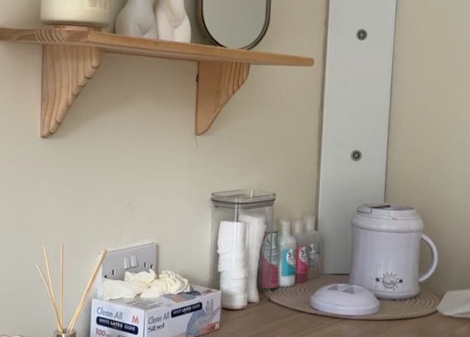 Tranquil skincare setup at Em Beauty Care in Airdrie, Scotland, GB with essential oils and treatment tools.
