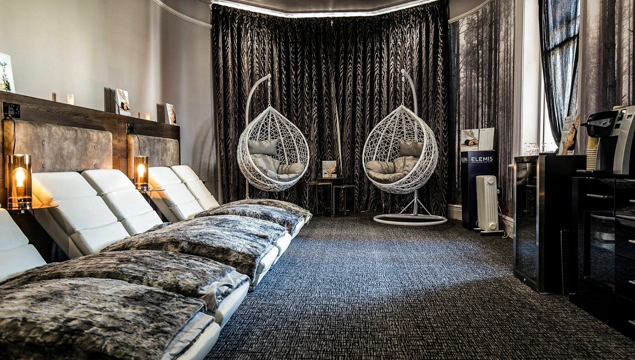 Luxury relaxation area with hanging chairs at Beautyh - Hoburne Bashley, New Milton, England, GB.