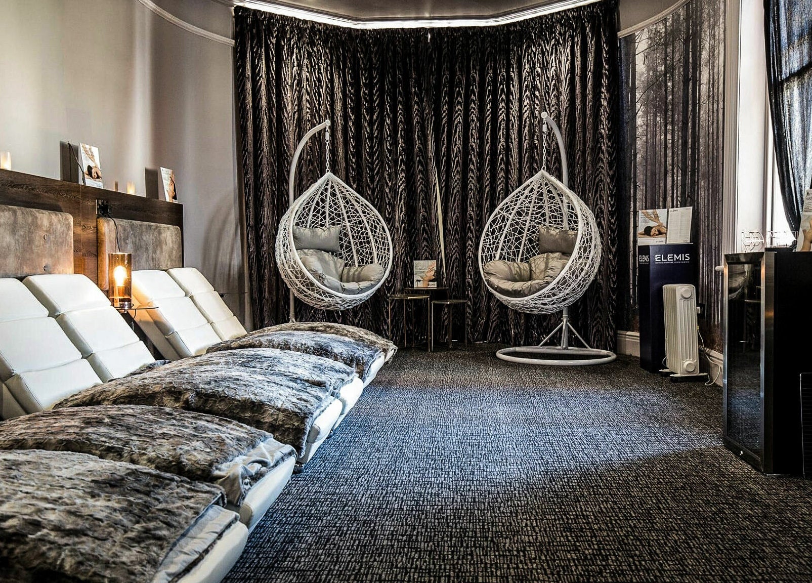 Luxury relaxation area with hanging chairs at Beautyh - Hoburne Bashley, New Milton, England, GB.