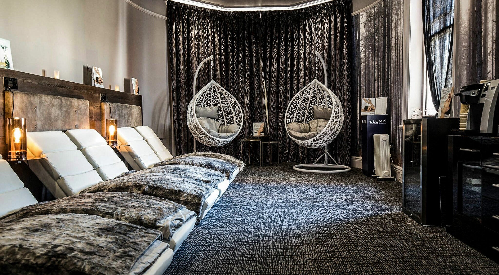 Luxury relaxation area with hanging chairs at Beautyh - Hoburne Bashley, New Milton, England, GB.