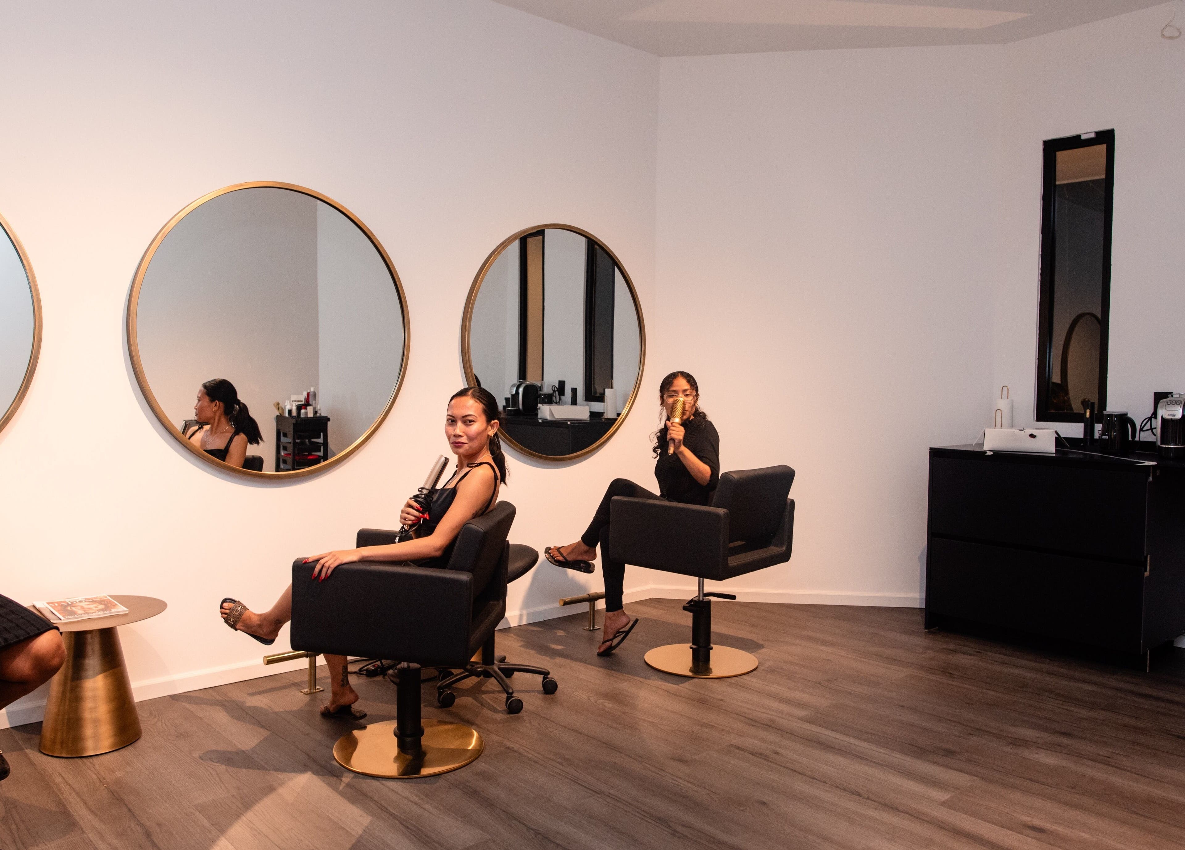 Modern salon interior at Delete Beauty Lounge, Paramaribo, Paramaribo, SR featuring stylish mirrors and seating.