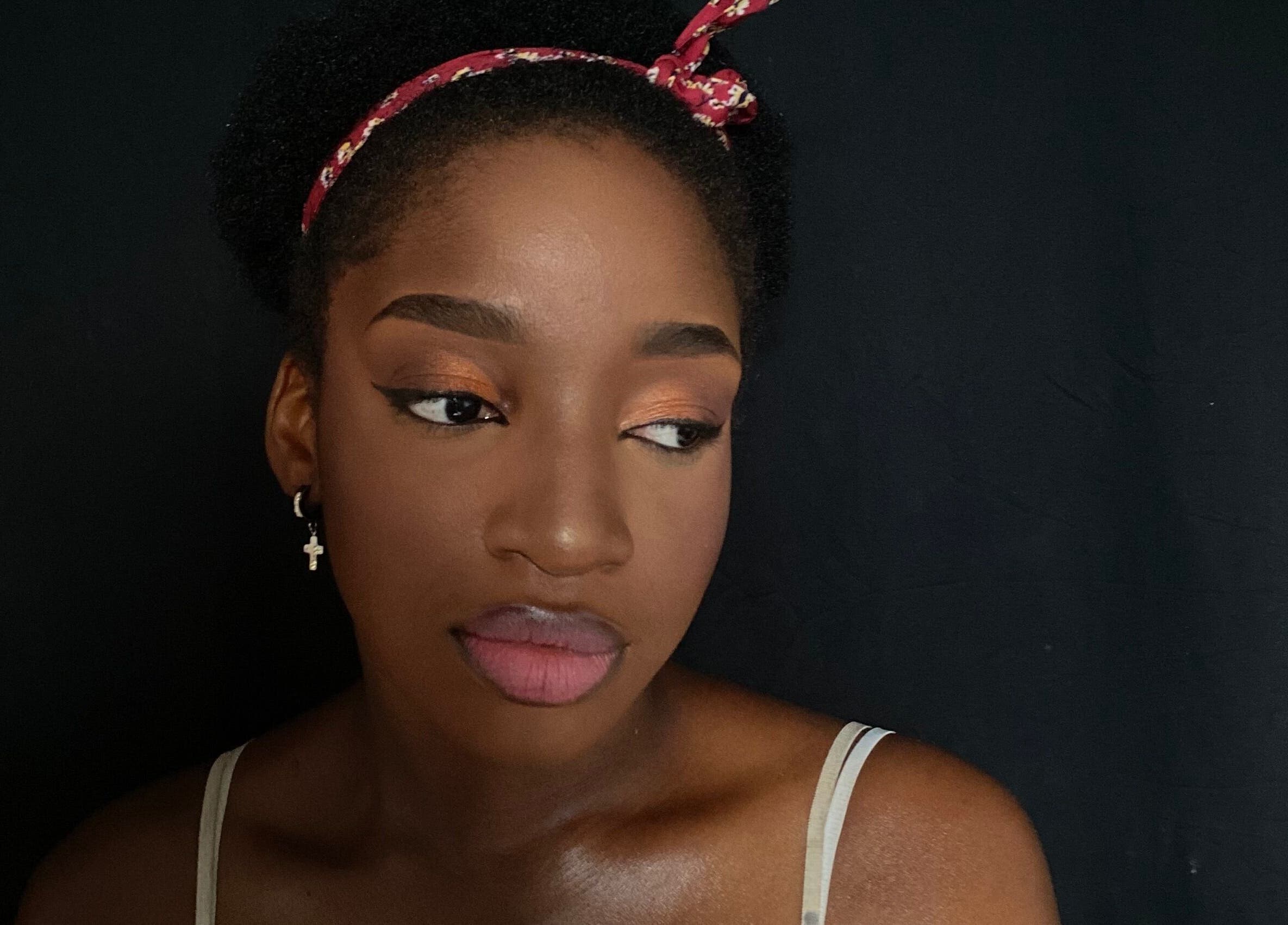 Close-up of a woman's face with elegant makeup at Beatsbyzara, Lagos, Lagos, NG.