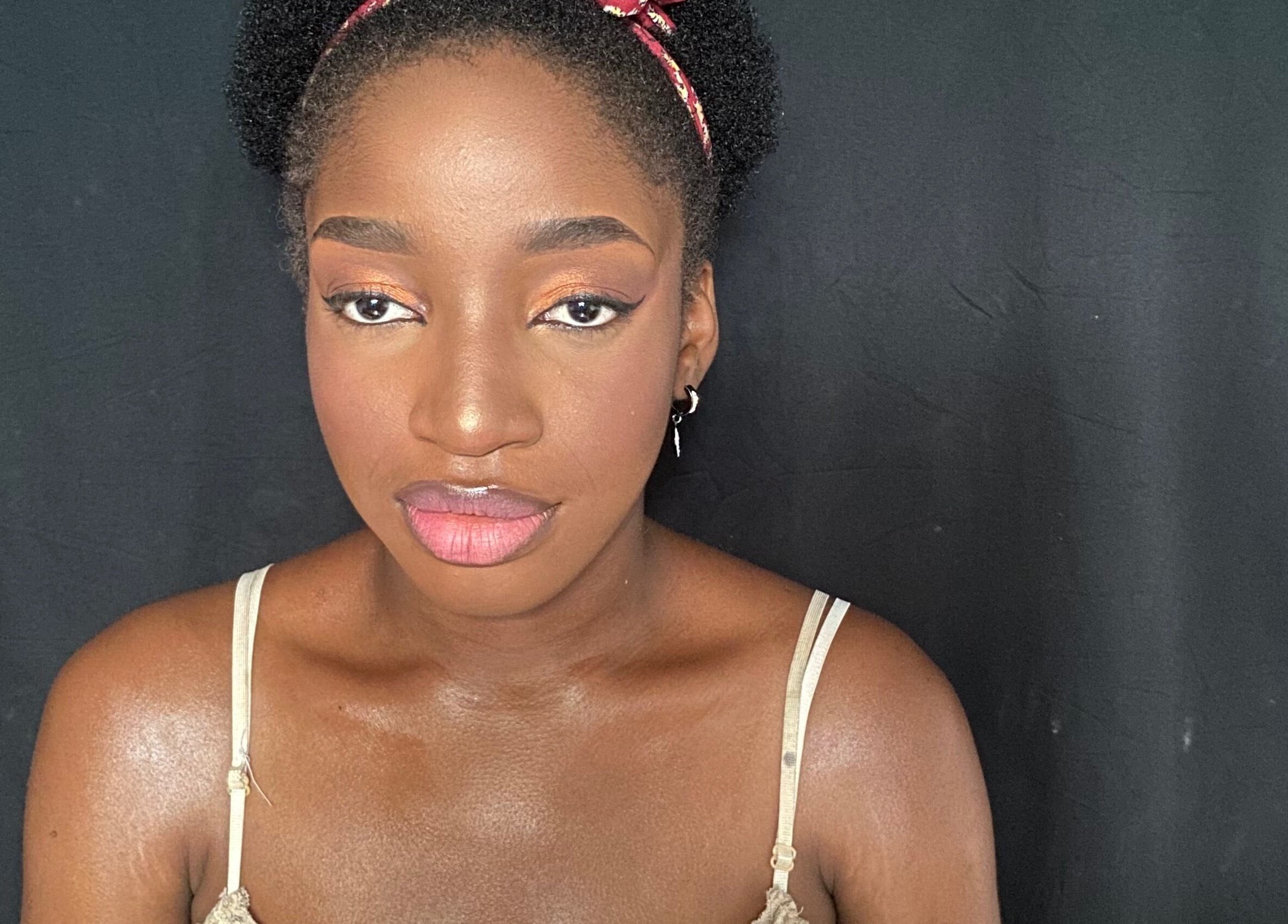 Close-up of a woman with radiant makeup at Beatsbyzara, Lagos, Lagos, NG.