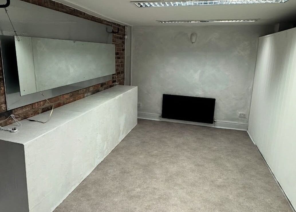 Modern interior of M in Da Cut, Manchester, England, GB, with exposed brick and large mirror.