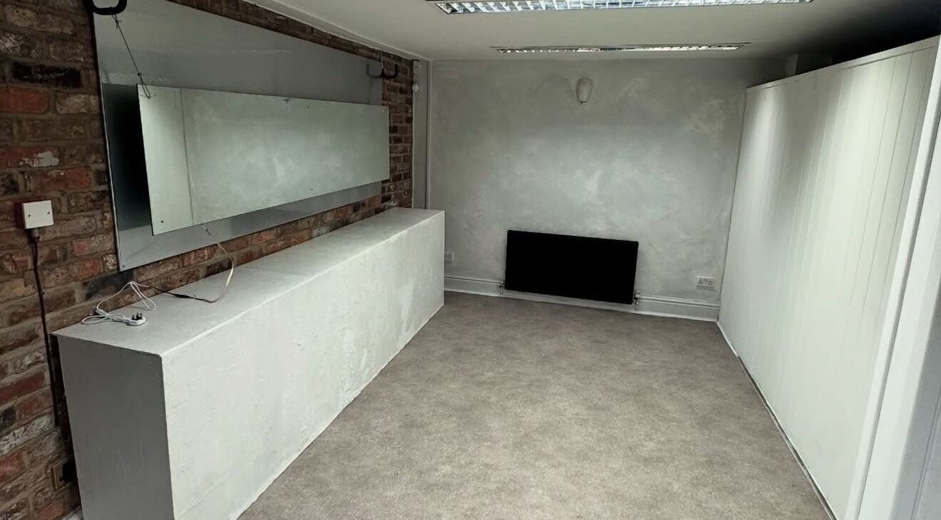 Modern interior of M in Da Cut, Manchester, England, GB, with exposed brick and large mirror.