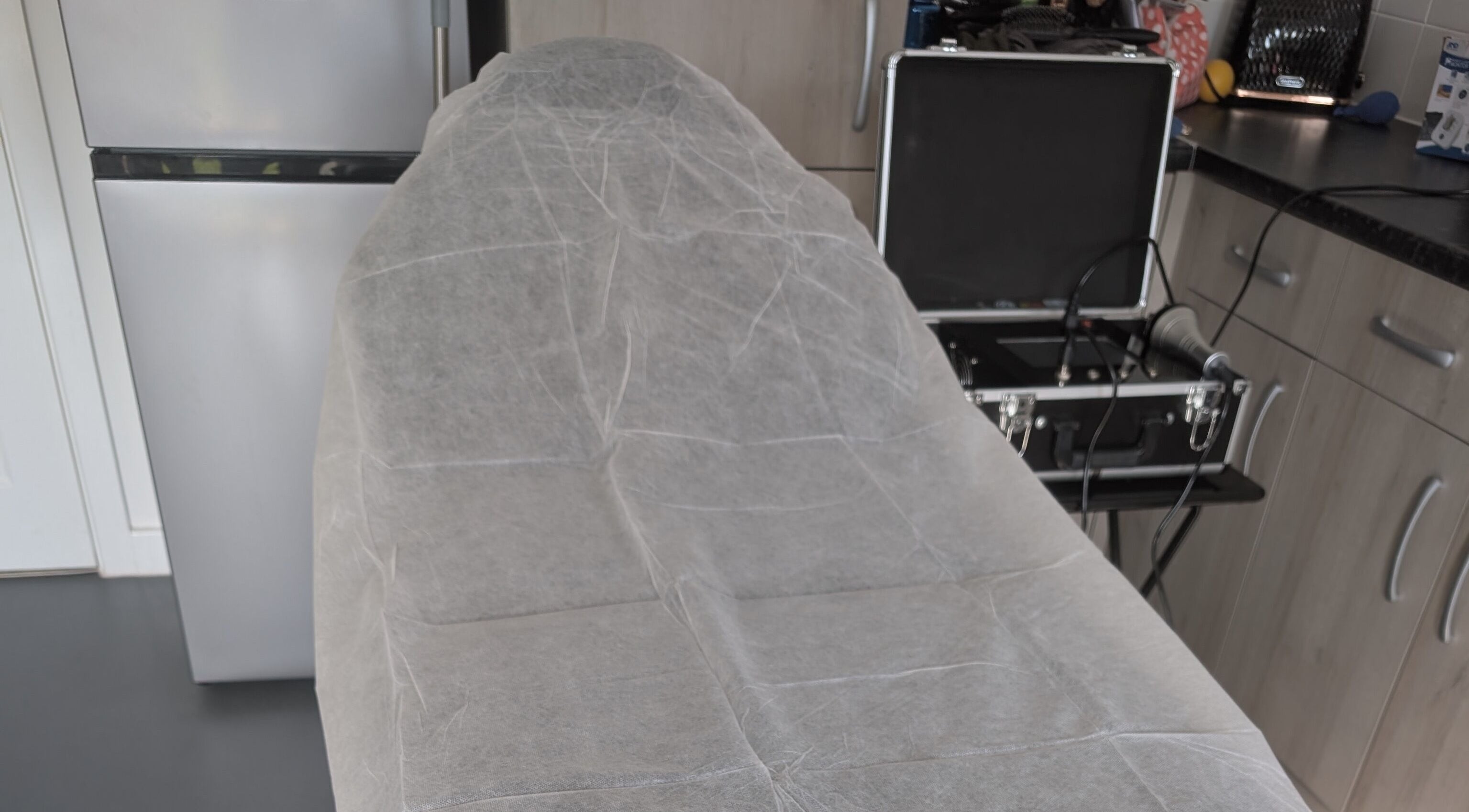 Treatment bed at Novaré Confidence, Market Harborough, England, GB, ready for wellness session.