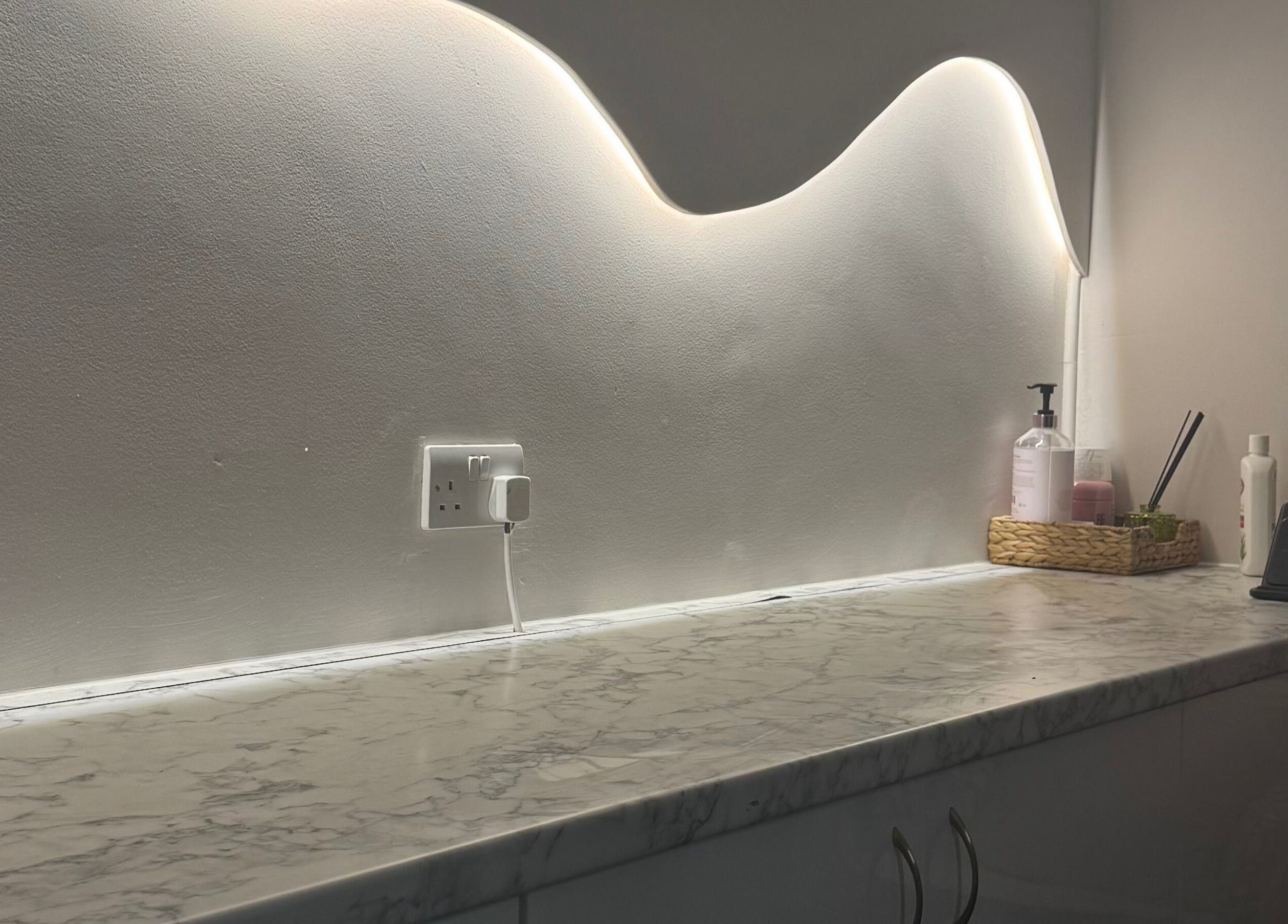 Elegant marble counter with ambient lighting at By Amarni Tian in London, England, GB.